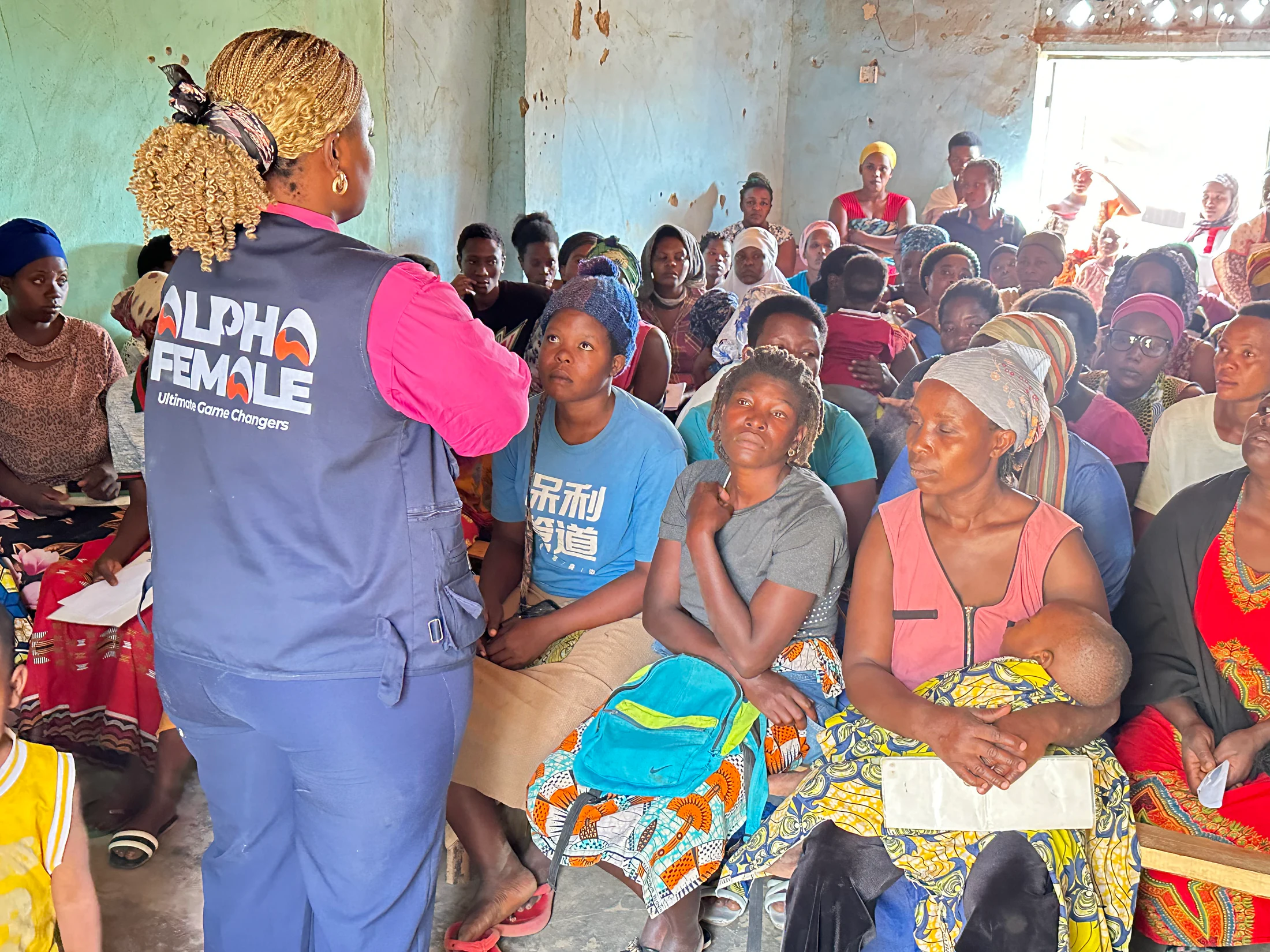Community members listening during an Alpha Female session
