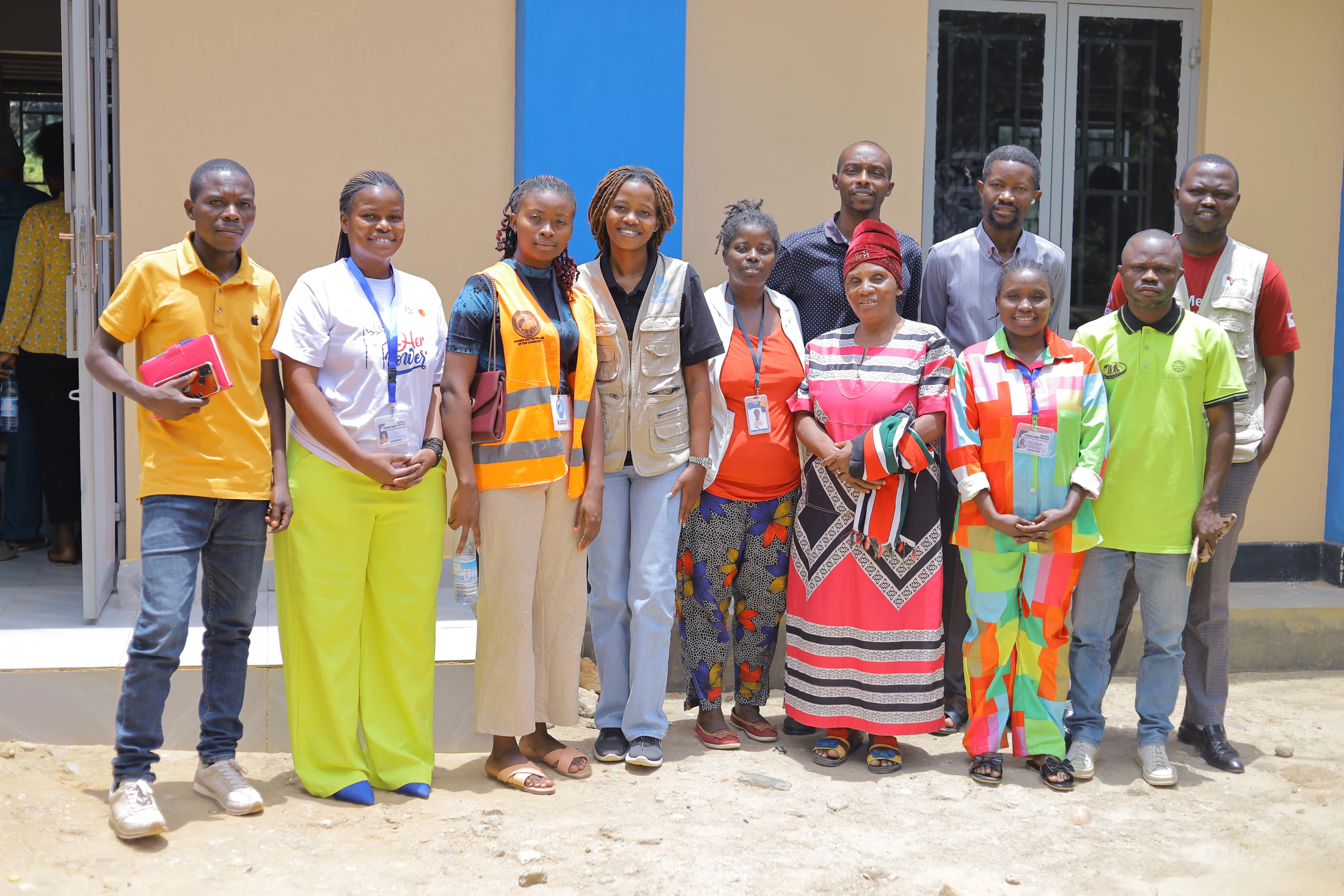 Alpha Female team members standing together outside their community space