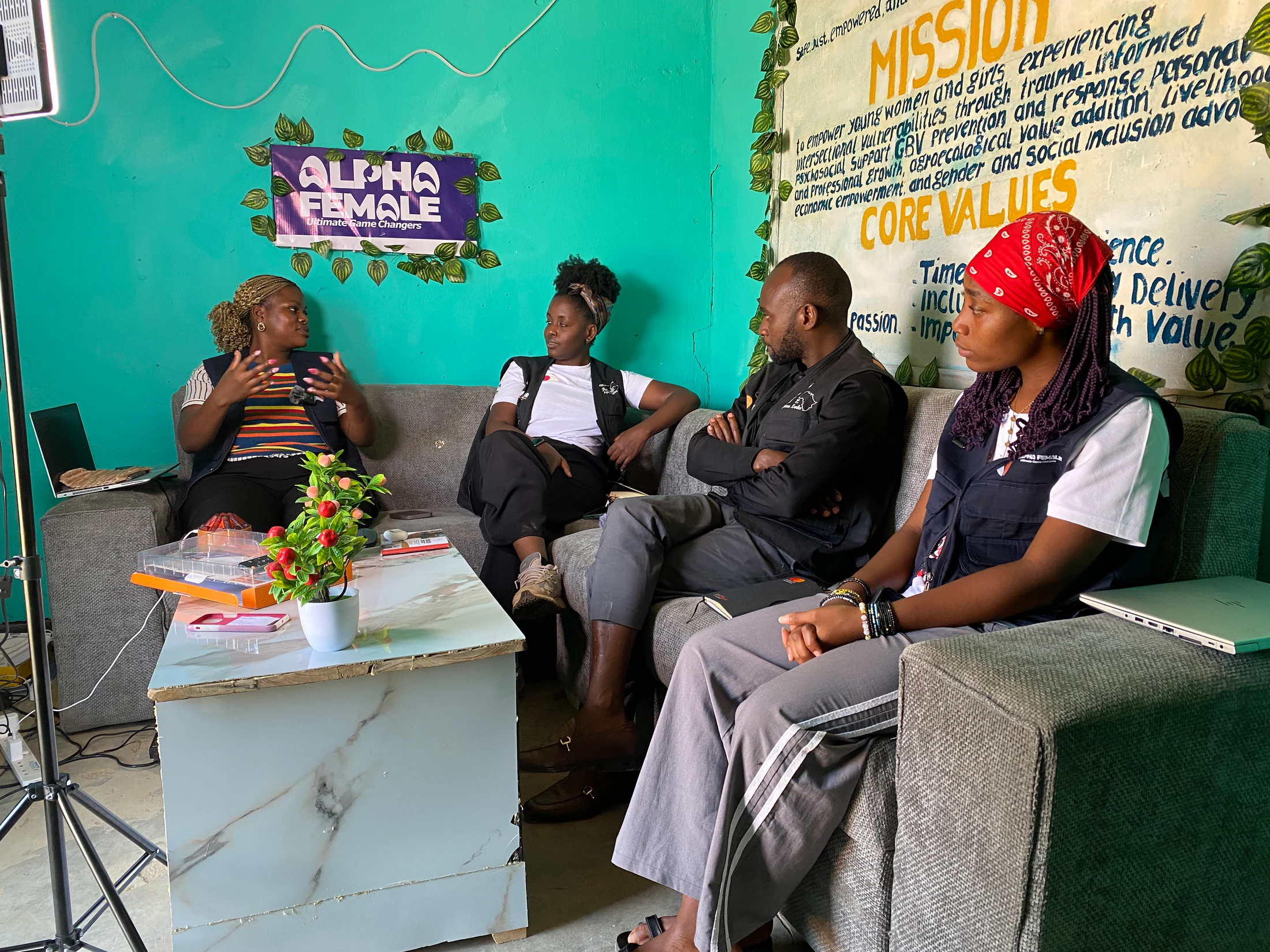 Alpha Female team members in conversation inside their community space